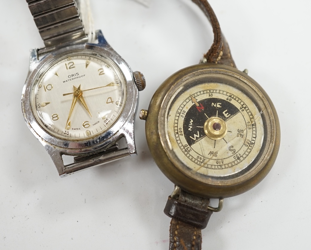 A gentleman's stainless steel Oris manual wind wrist watch and a base metal wrist compass. Condition - poor to fair